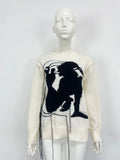 Women's loose fit alpaca wool sweater with tassel details and abstract pattern in street fashion style