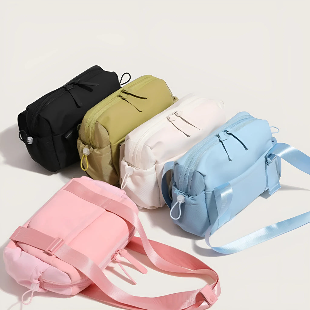 Large capacity nylon travel buggy bag with double shoulder straps and zip compartments in pink, blue, black, green or creamy-white