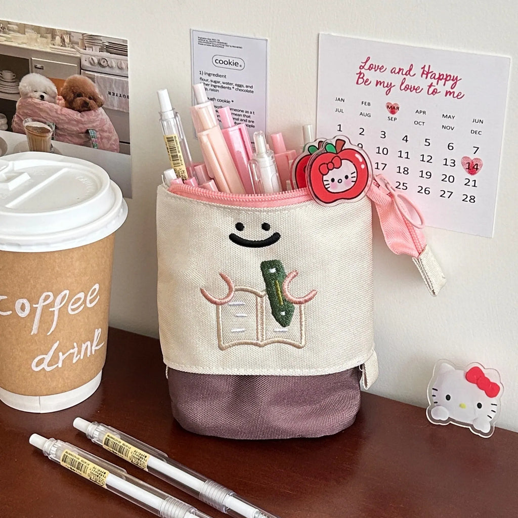 Brown collapsible pencil case with cartoon print, showing 17cm by 14cm size.