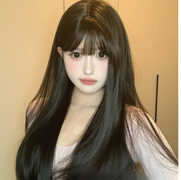 Dark brown synthetic long straight wig with bangs on wig head