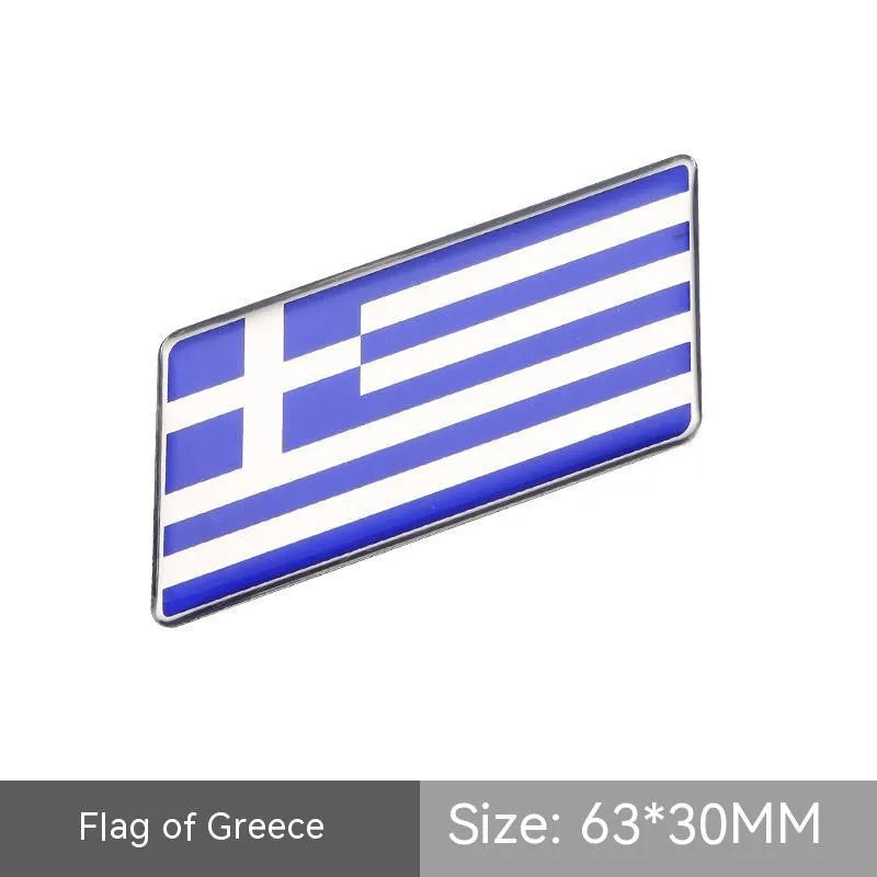 Aluminium national flag car sticker in a parallelogram shape measuring 6.3 by 3 centimetres.