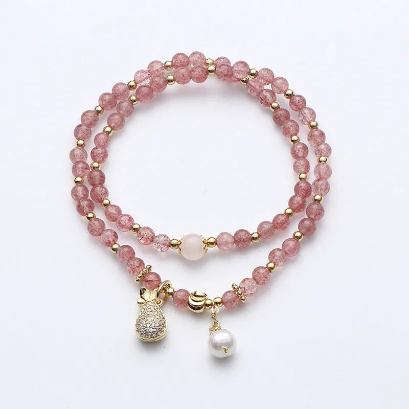 Strawberry quartz crystal bracelet with geometric pink beads on adjustable string