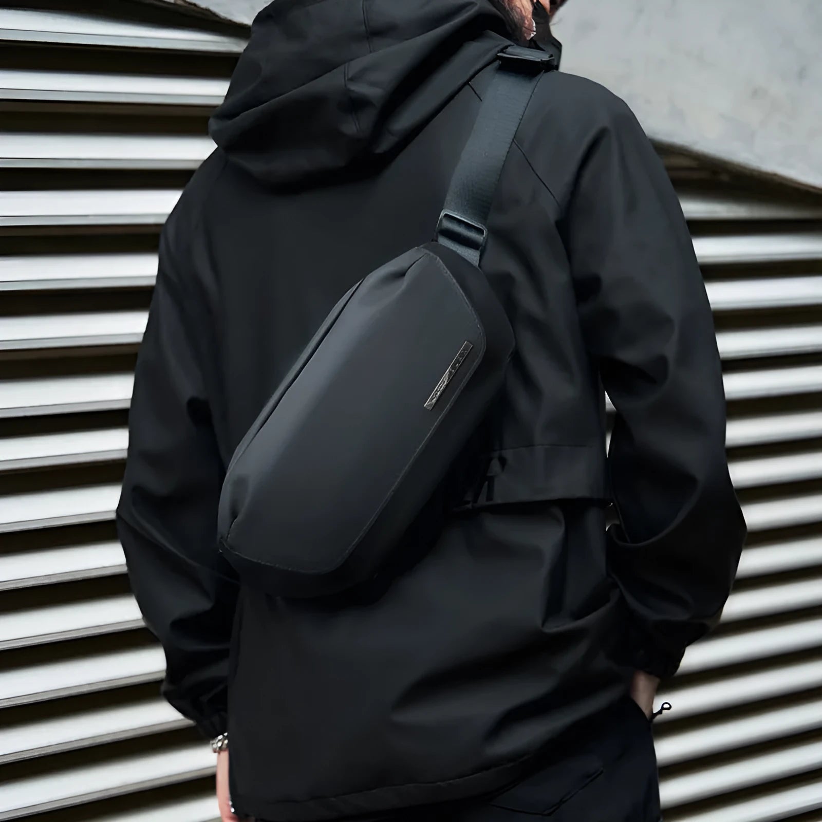 Black men's messenger bag made from Oxford cloth with cross-body strap and street trend design
