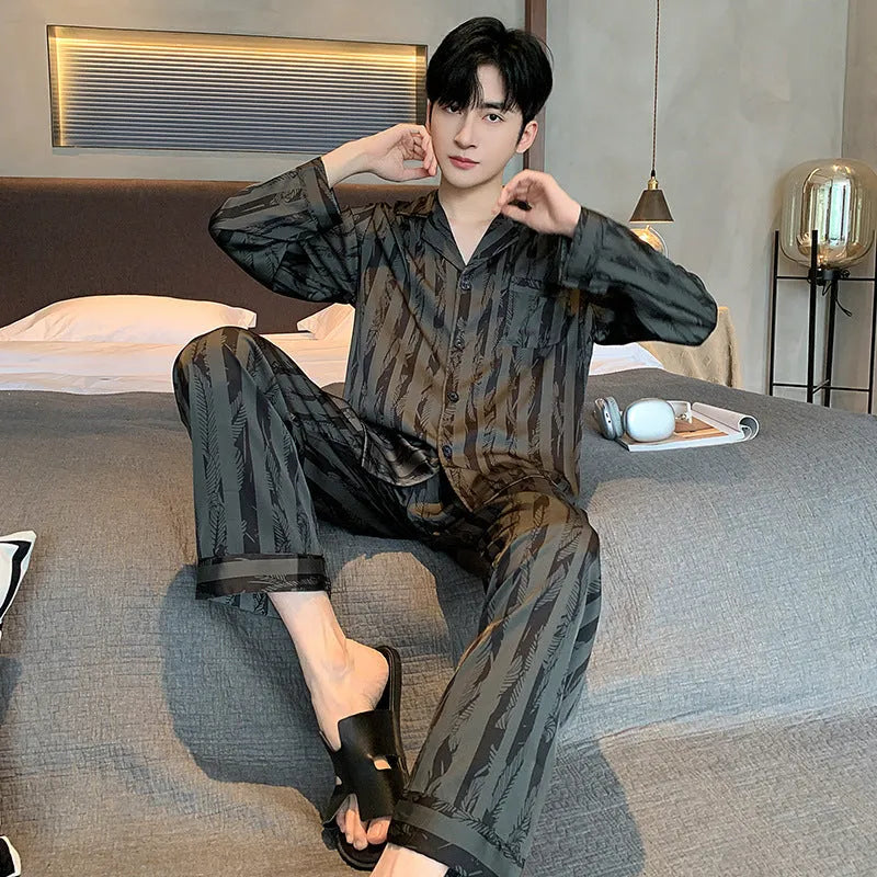 Black striped men's ice silk two-piece pajama set with V-neck top and long trousers.