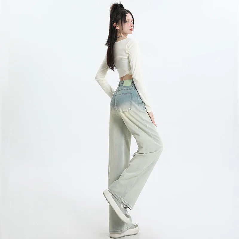 Women's gradient blue straight-leg jeans showing colour transition from lighter to darker blue tones