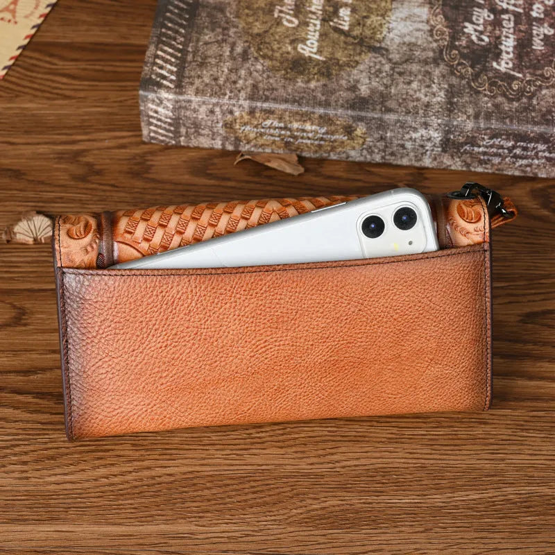 Women's tri-fold wallet with embossed floral pattern in retro brown colour, showing organisational compartments
