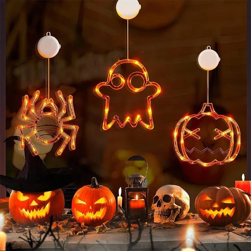 Halloween LED window lights showing spider, pumpkin and ghost designs with suction cup mounting