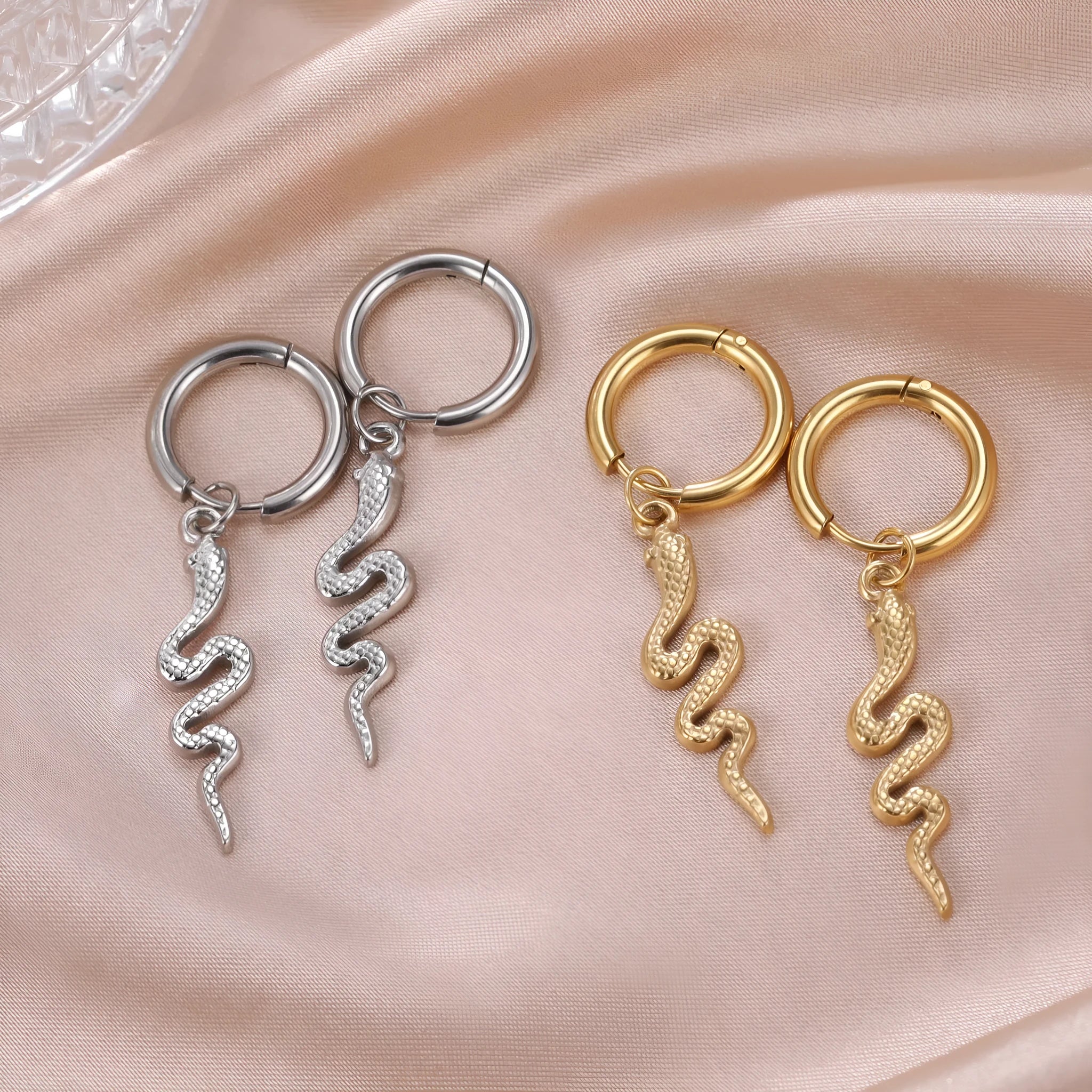 Gold snake clip-on earrings in vintage animal zodiac design