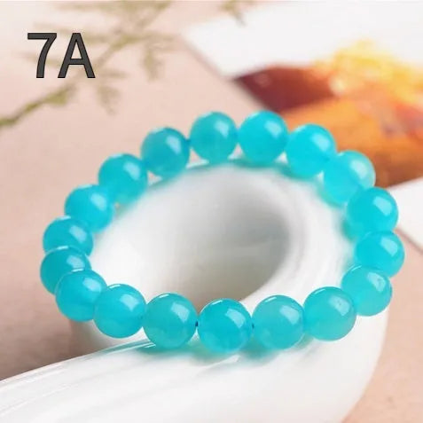 Natural amazonite scattered beads in blue-green ice colour showing polished surfaces and multiple size options