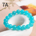 Natural amazonite scattered beads in blue-green ice colour showing polished surfaces and multiple size options