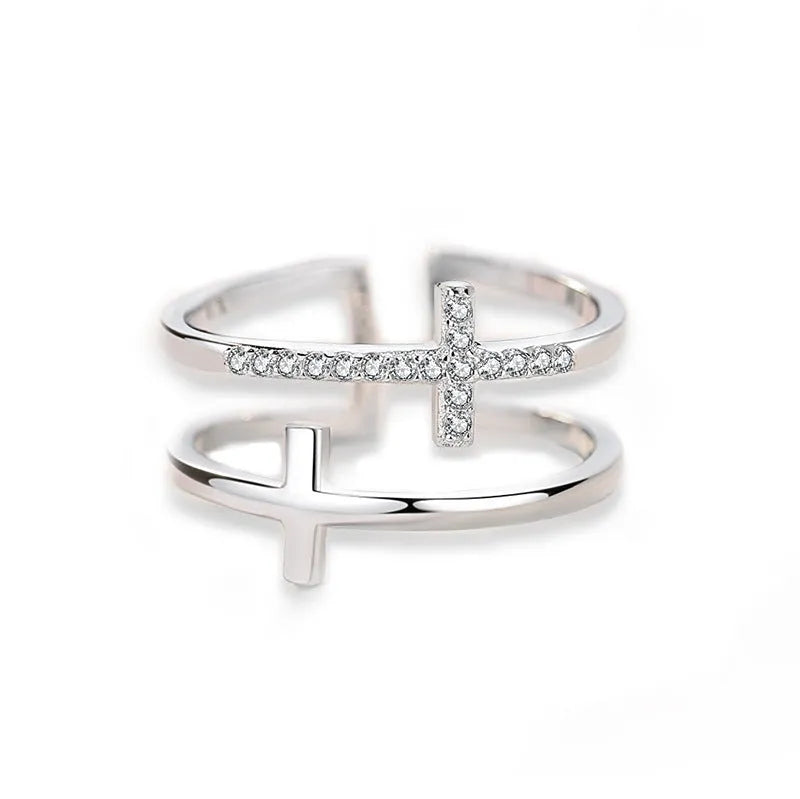 Adjustable copper women's ring with double cross design, zircon stones, and sterling silver inlay in white gold finish.