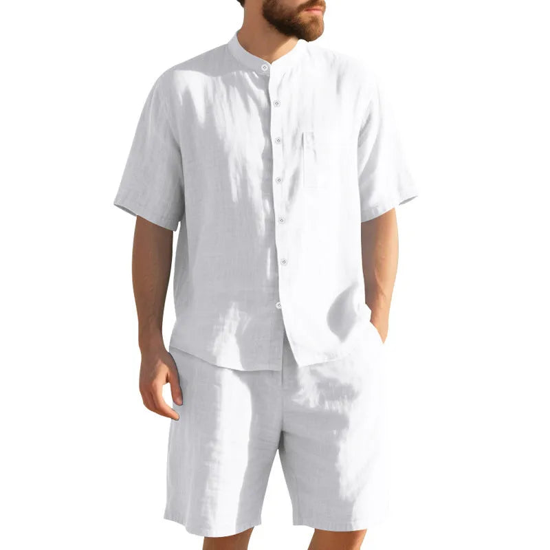 Men's light blue linen blend summer suit with short sleeve shirt jacket and matching shorts on a hanger.