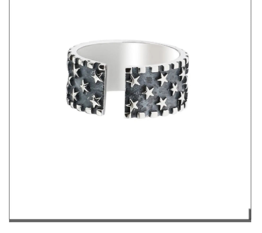 Adjustable opening sterling silver ring with a five-pointed star geometric design.