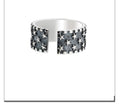 Adjustable opening sterling silver ring with a five-pointed star geometric design.