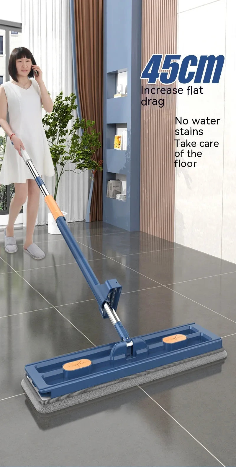 Large flat mop with extended stainless steel handle and blue fine fibre cloths on rotating head