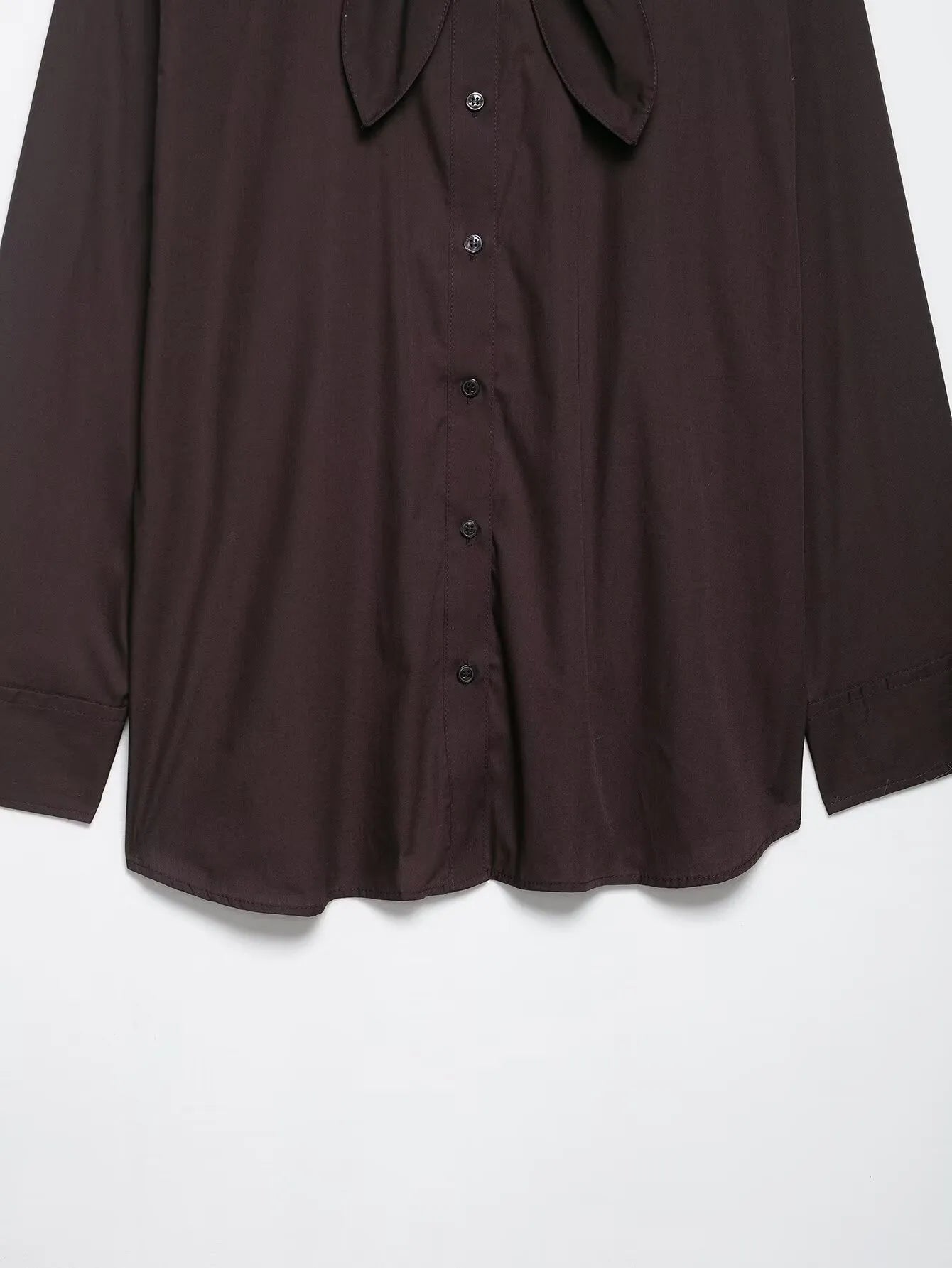 Brown women's long sleeve poplin shirt with a bow tie, shown in a loose cardigan style.