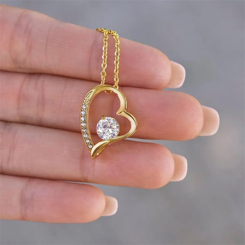 Hollow heart-shaped necklace in silver or gold with card and gift box.