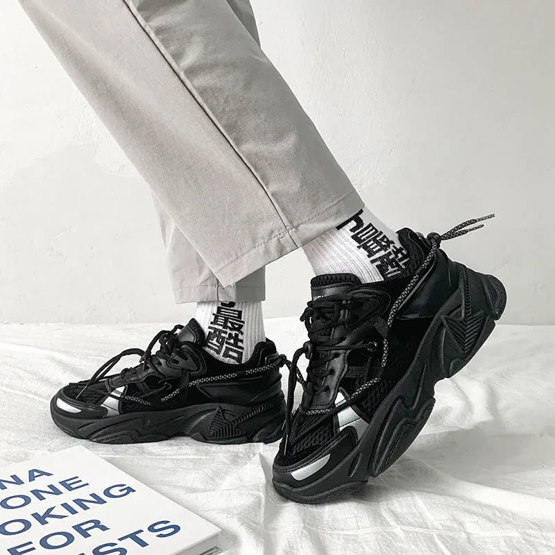 Men's white platform dad shoes with lace-up front on a neutral background.