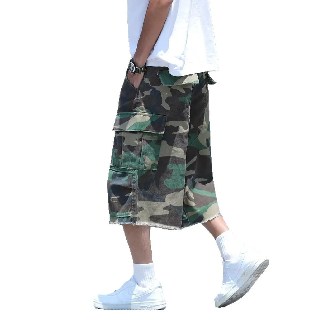American style retro workwear loose camouflage shorts in cropped length on a neutral background.