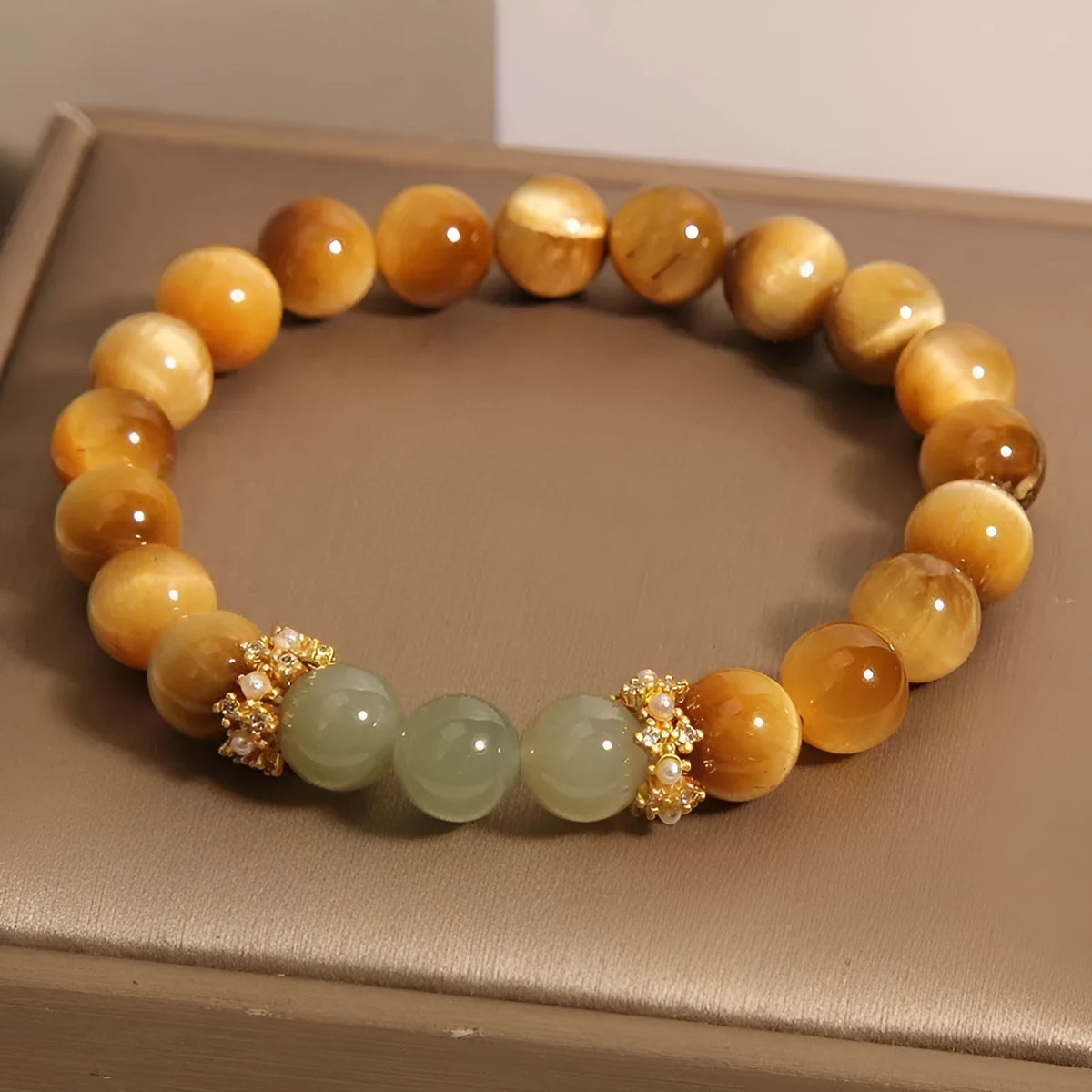 Natural yellow Tiger's Eye Hetian Jade bracelet with U-shaped design and auspicious patterns