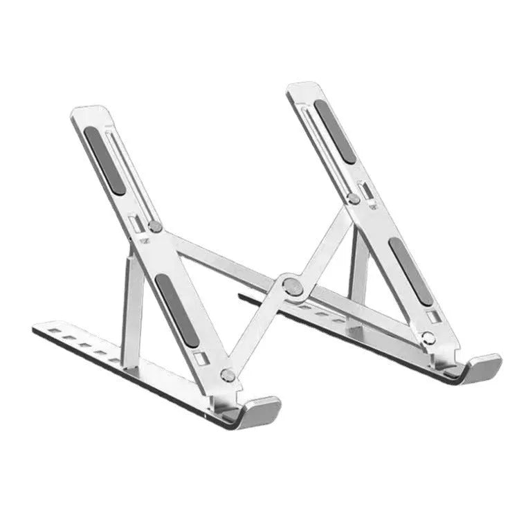 Silver aluminium laptop stand folded next to an open laptop, showing its portable size.