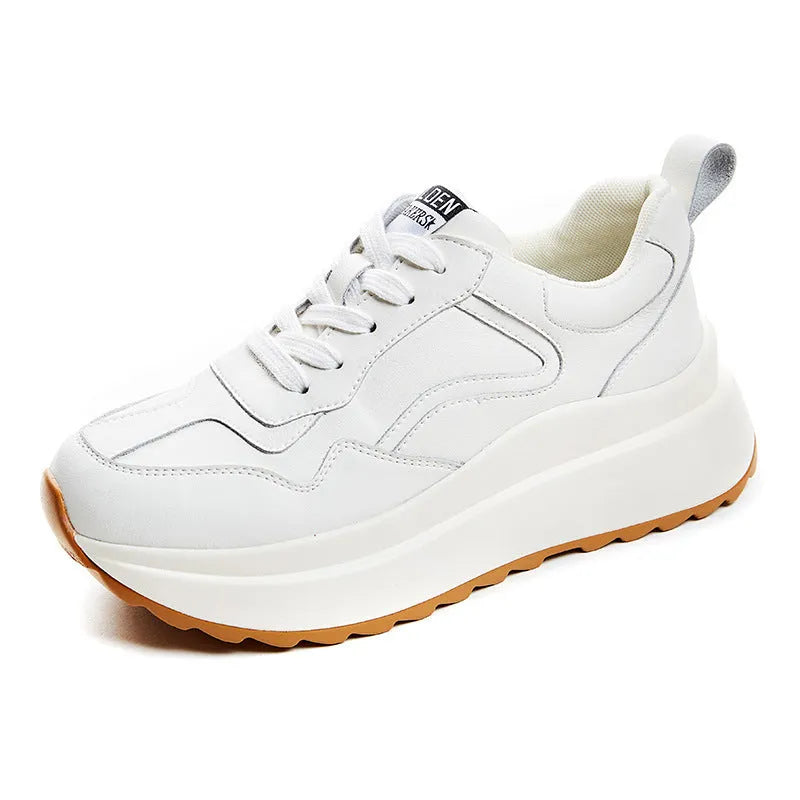 Beige women's cowhide leather low-top sports shoes with cross-strap and visible stitching on a round toe.