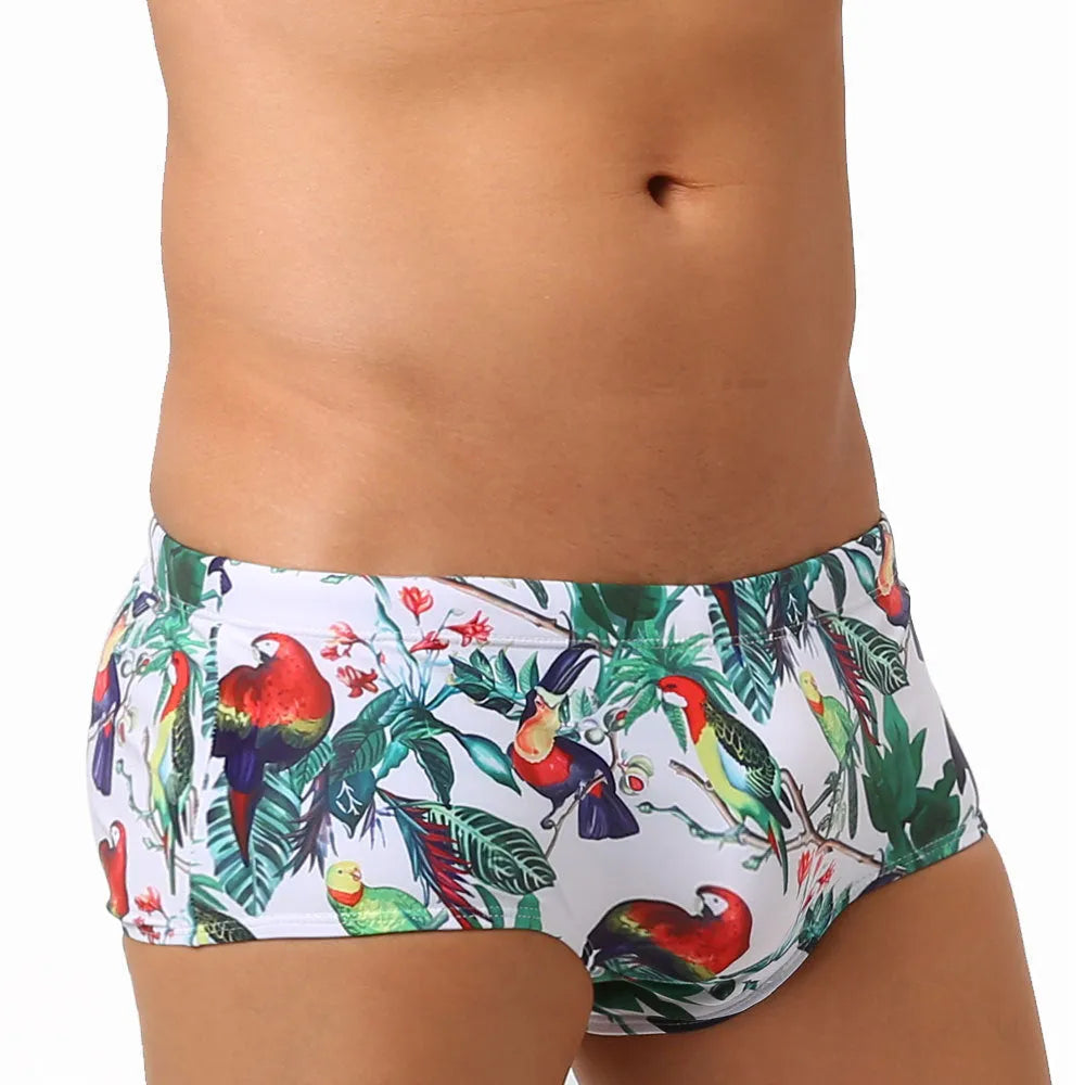 Men's swimming trunks with a colourful floral and bird print, shown in briefs and boxers styles.