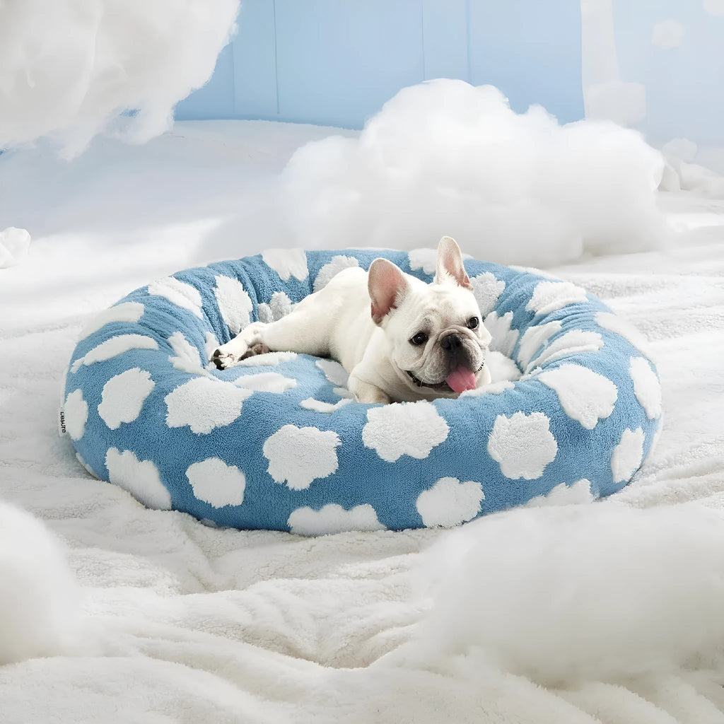 Round plaid dog bed with a plastic base, shown in a sea blue and white colour.