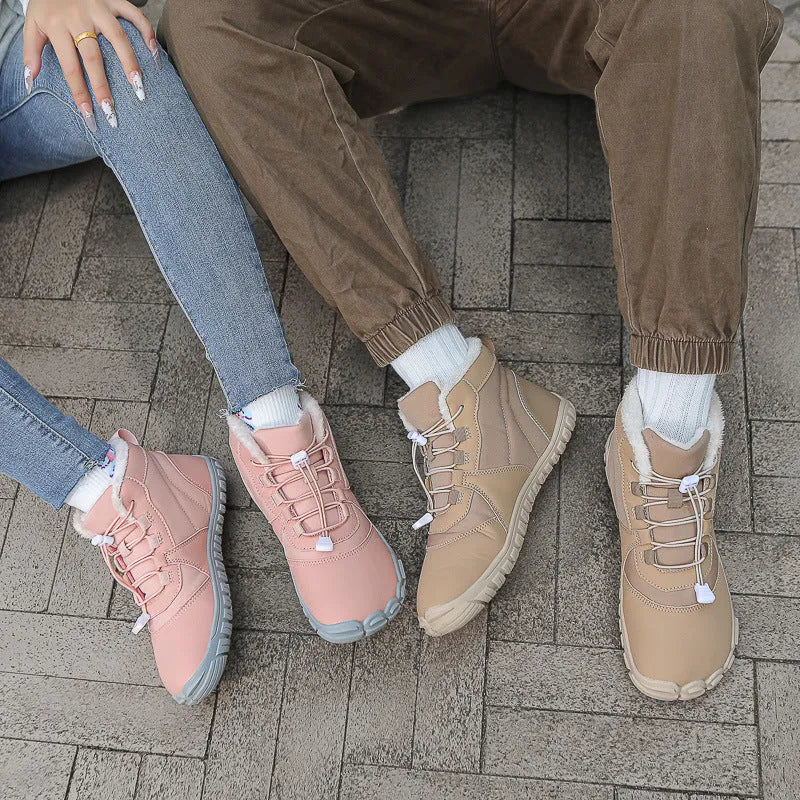 Outdoor snow boots in black, khaki, or pink with a lace-up front and rubber sole.