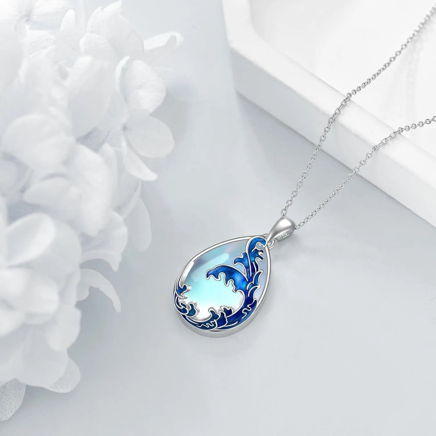 Moonstone blue heart-shaped pendant necklace on display