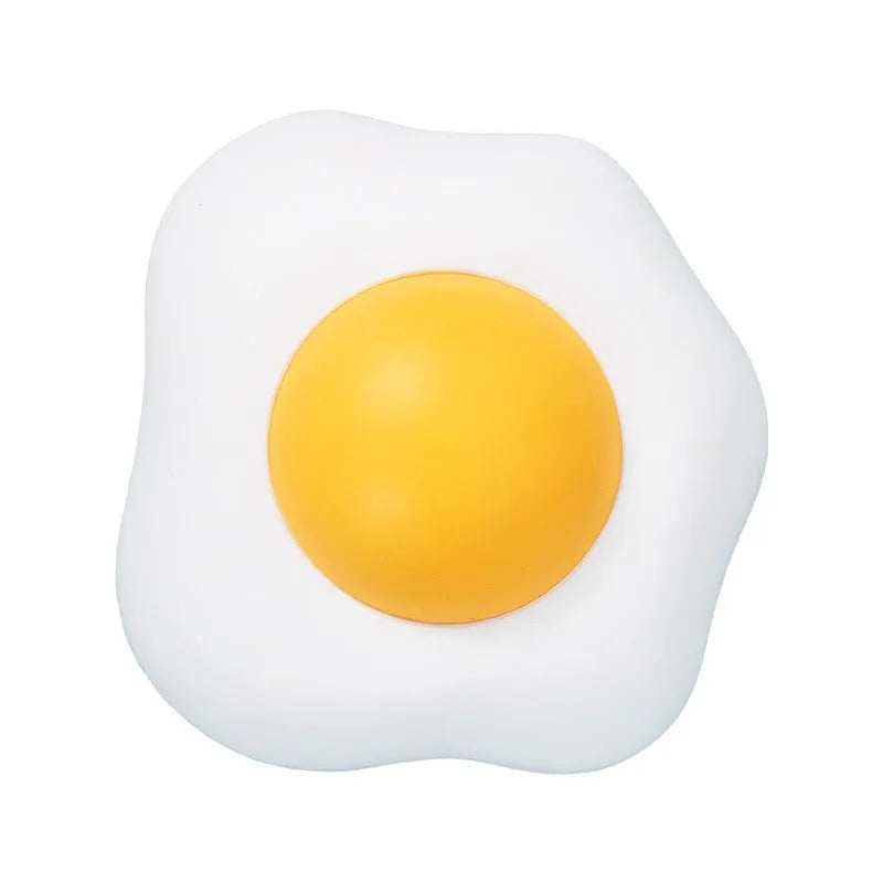 Catnip ball toy in fried egg and poached egg shapes with adhesive backing for wall and floor play