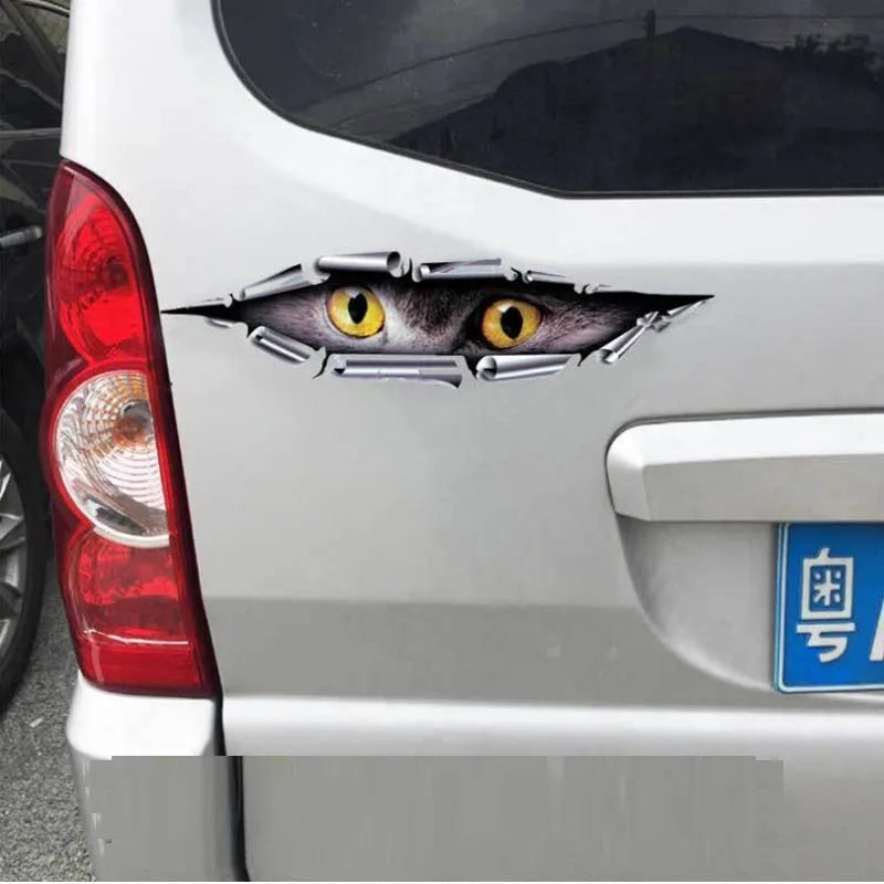 Close-up of a 3D transparent tiger eye car bumper sticker on a vehicle door.