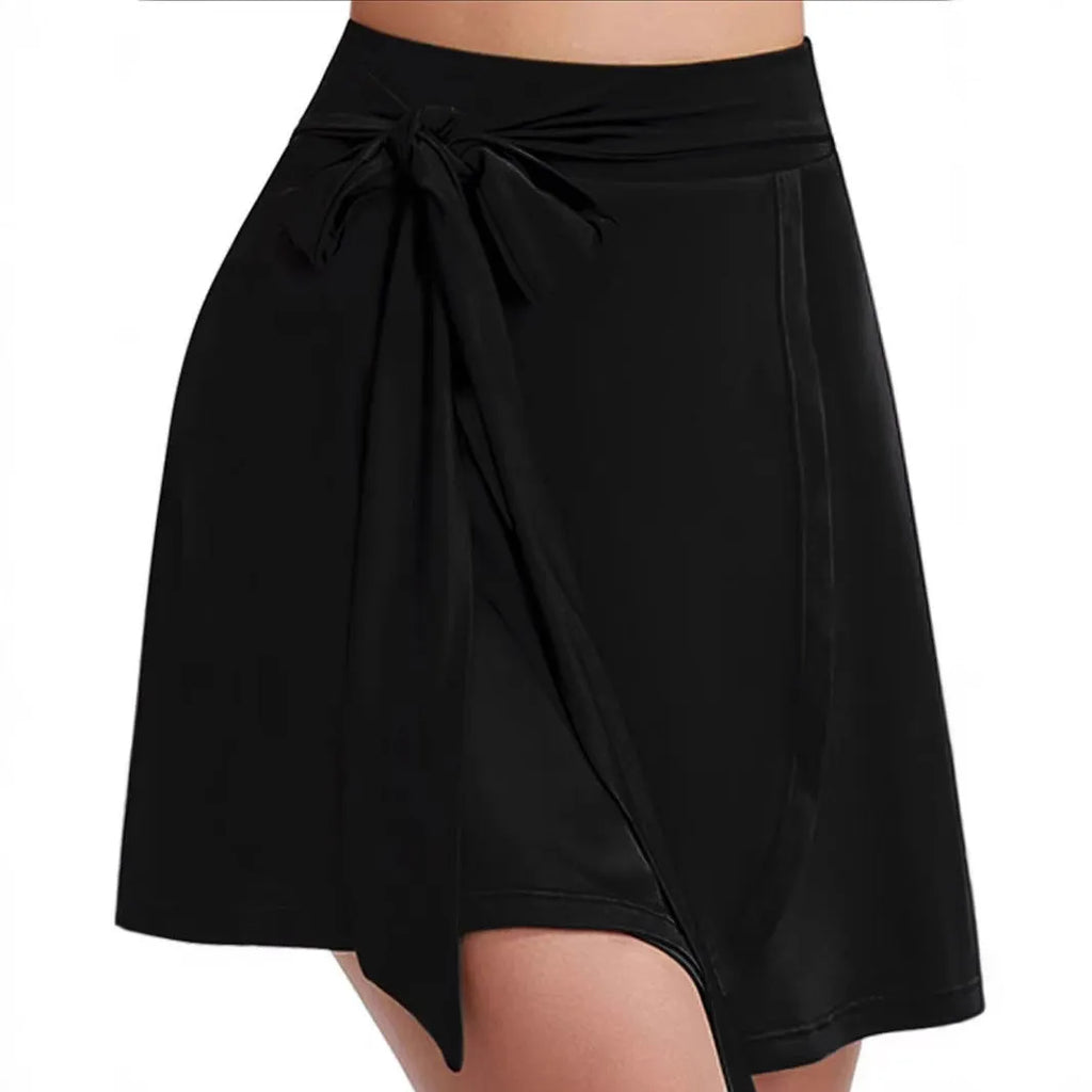 Black thigh-length unisex sports culotte skirt with high waist and integrated shorts layer.