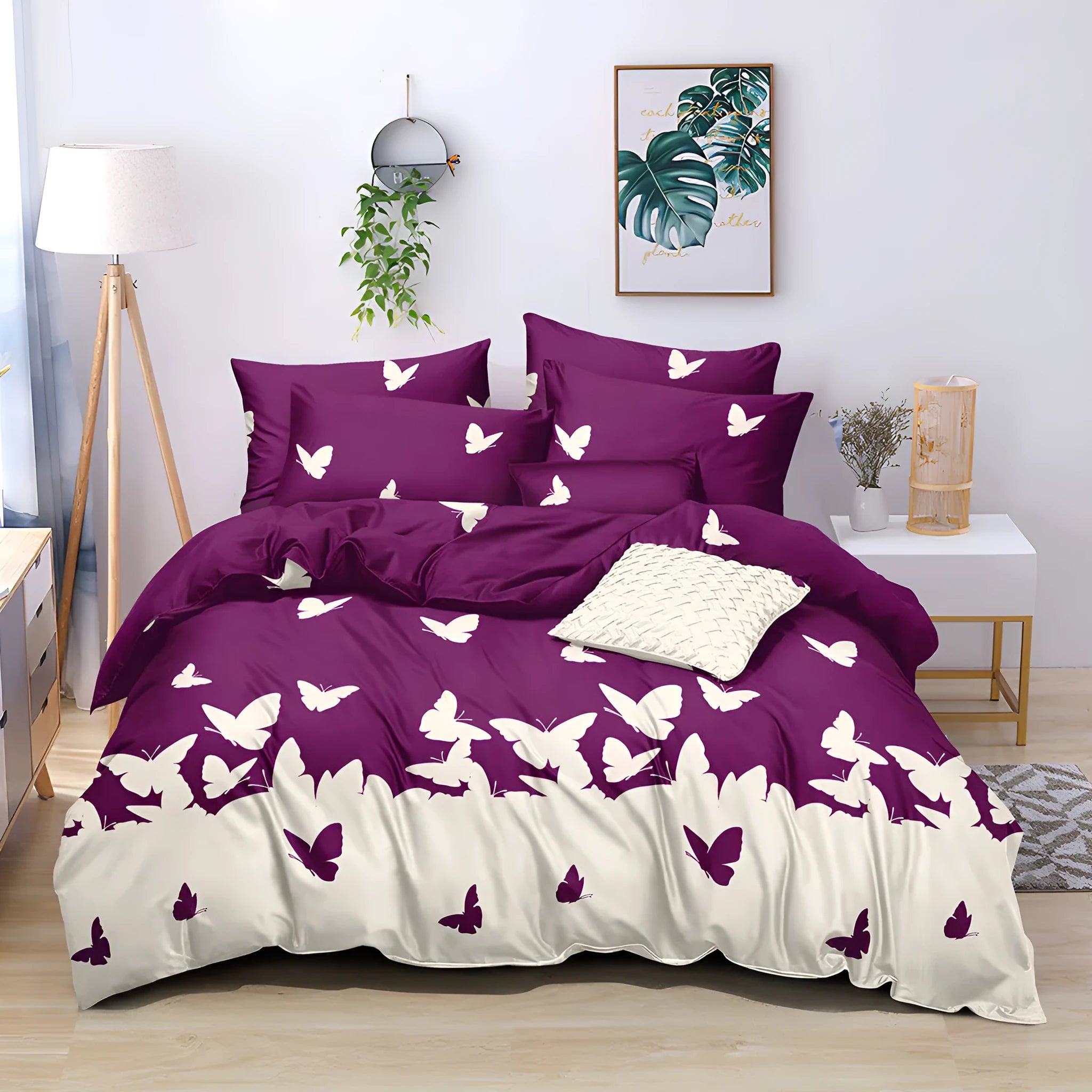 Purple butterfly reversible microfiber comforter set with two pillow shams on bed