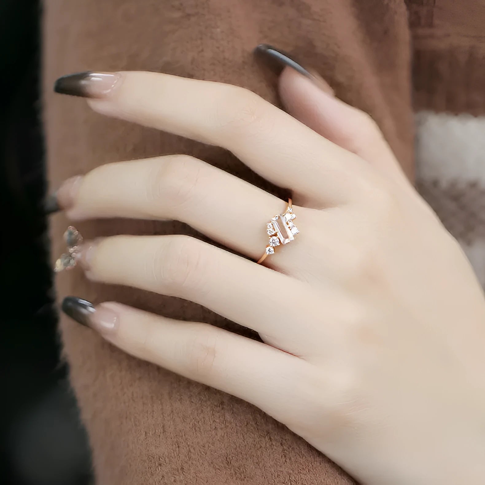 White crystal shiny electroplated silver women's ring on a white background