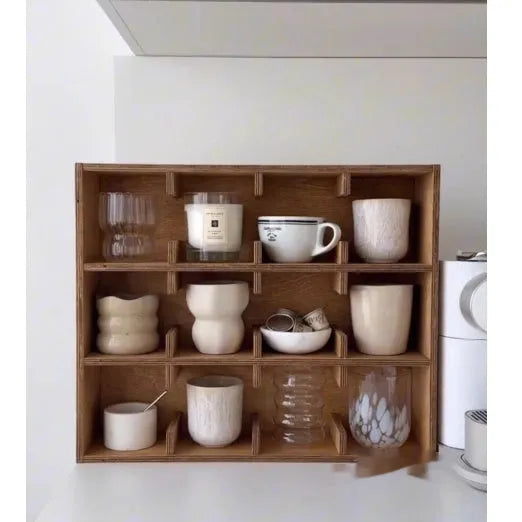 Square solid birch wood cup storage rack with multiple grid compartments in a natural meridian colour.