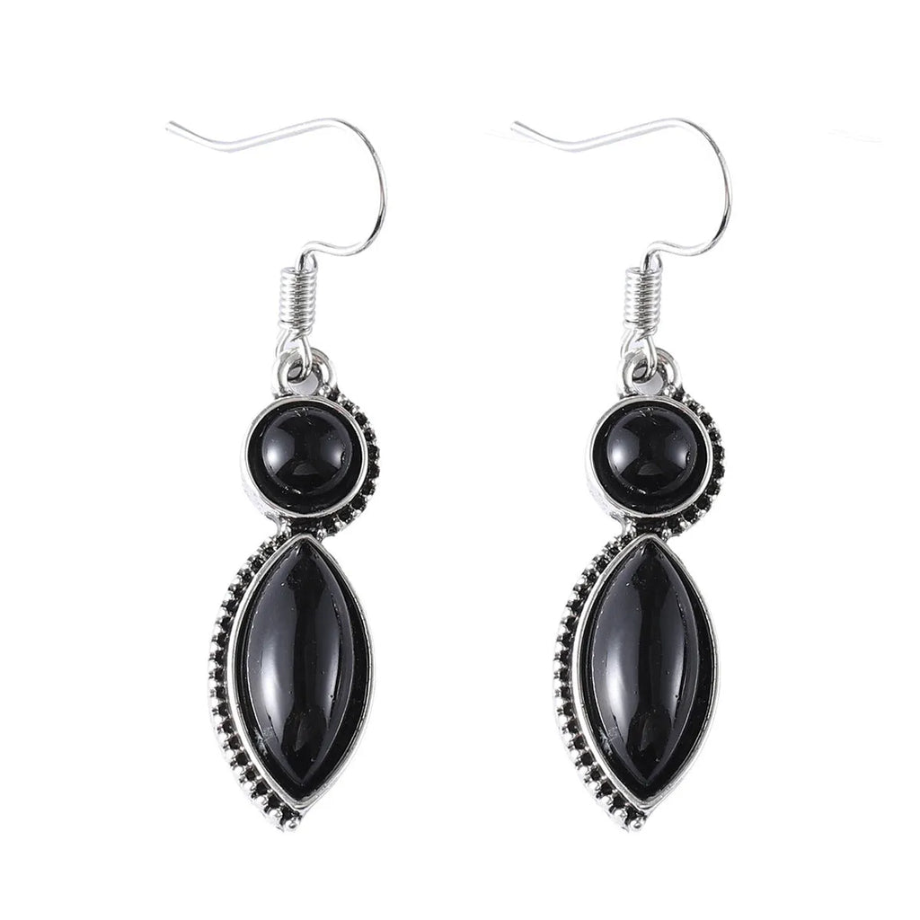 Pair of vintage geometric pendant earrings in black and purple zinc alloy with round retro design
