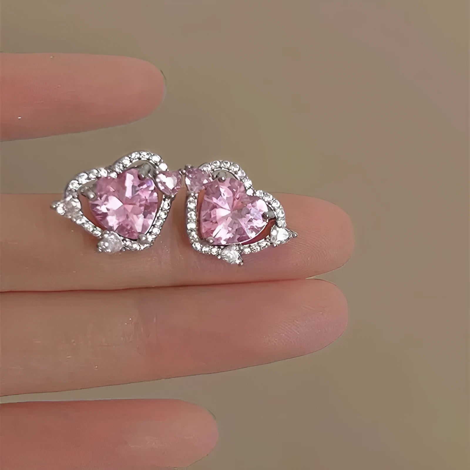 Guardian Heart white K stud earrings with heart shape design and butterfly backs.