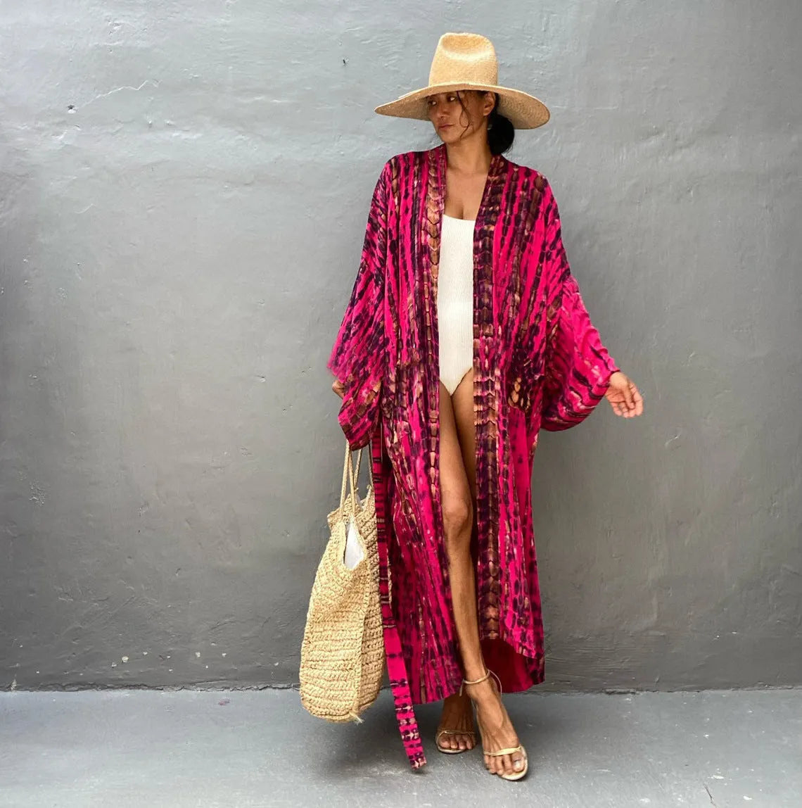 A printed, loose-fitting cotton beach cover-up blouse on a hanger, shown in a rust red colour from the DN0712 series.