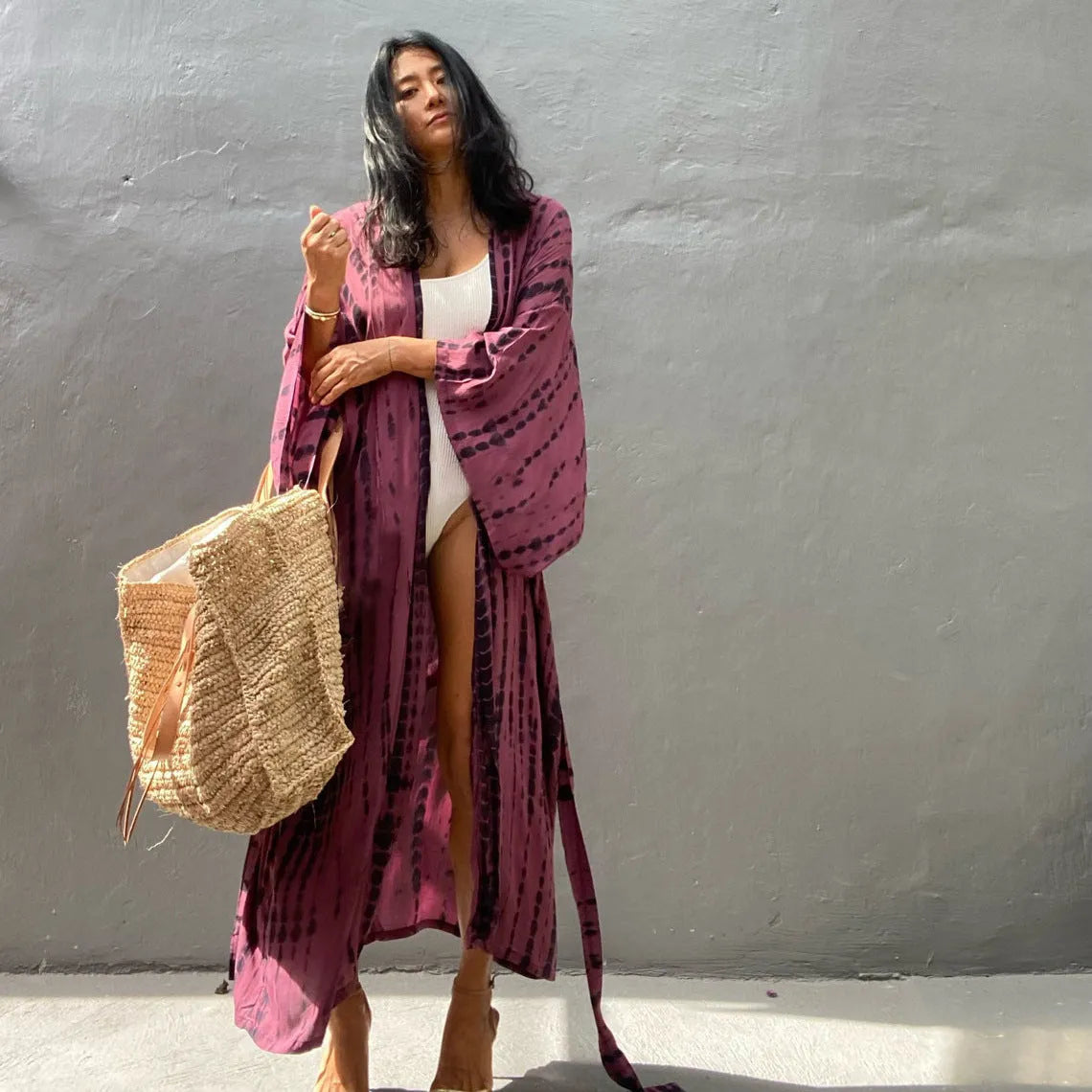 A printed, loose-fitting cotton beach cover-up blouse on a hanger, shown in a rust red colour from the DN0712 series.