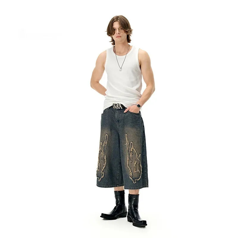 Men's black cropped denim shorts with flame embroidery patches, straight cut street style