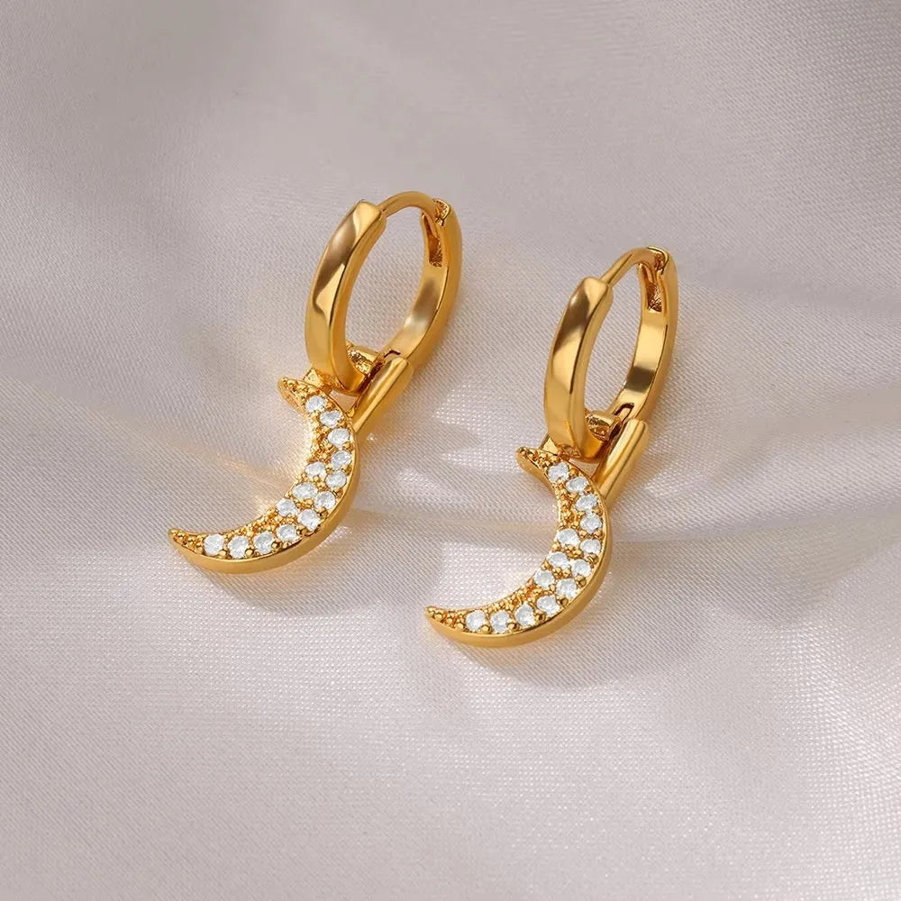 Women's copper butterfly earrings with geometric heart, star, and bow shapes in assorted colours.