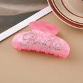 Pink and white acrylic shower shark hair clips with diamond embellishments and English letter details