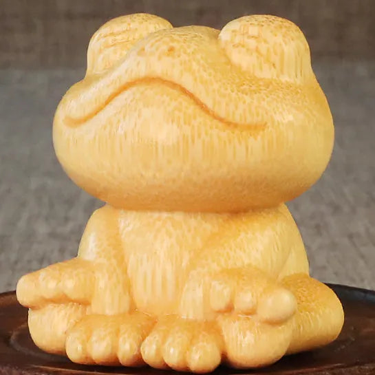 Solid bamboo carving ornament with smiling frog design measuring 5cm tall