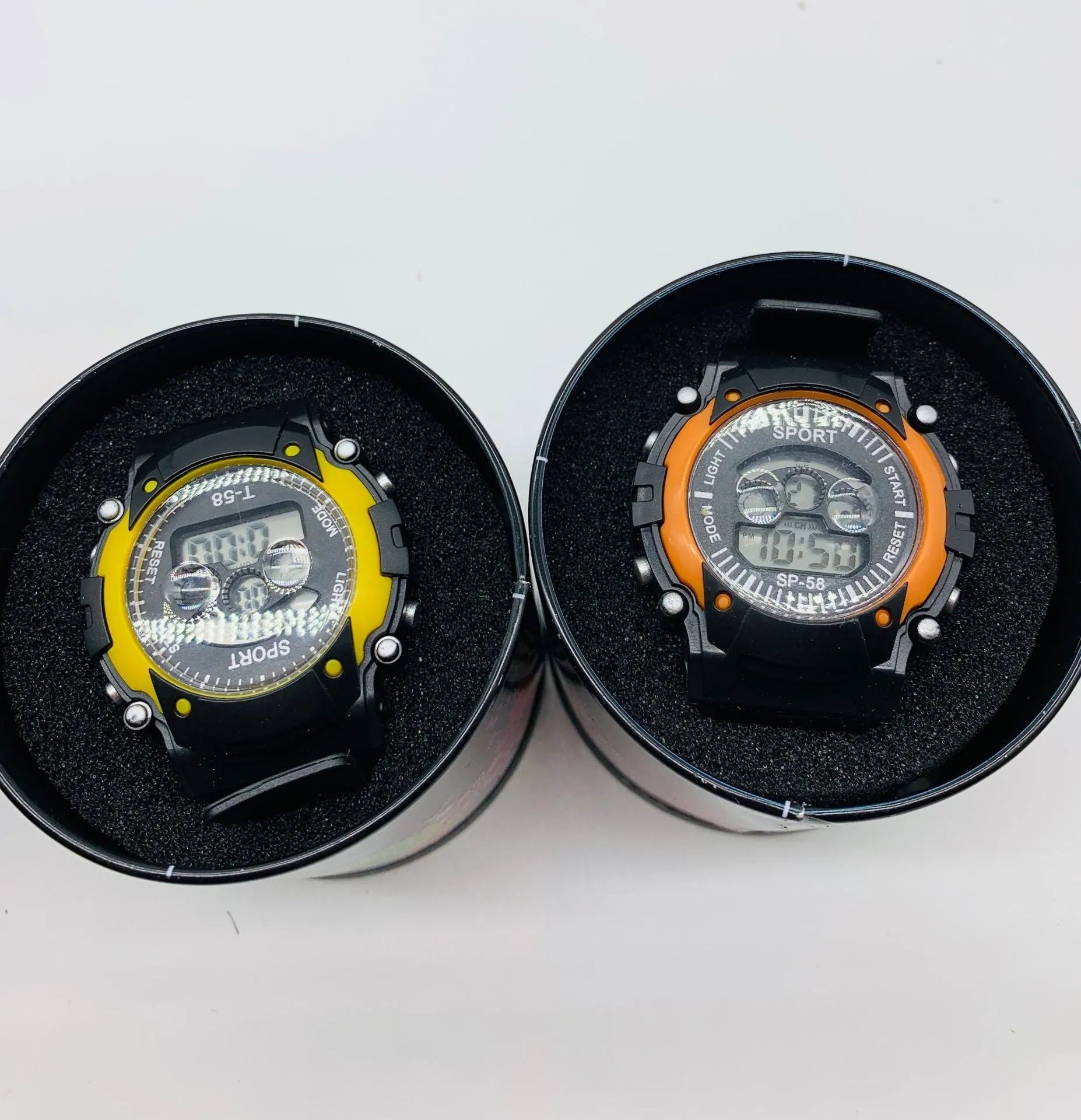 Digital sports watch for children with large face, silicone strap, and display showing time and date.