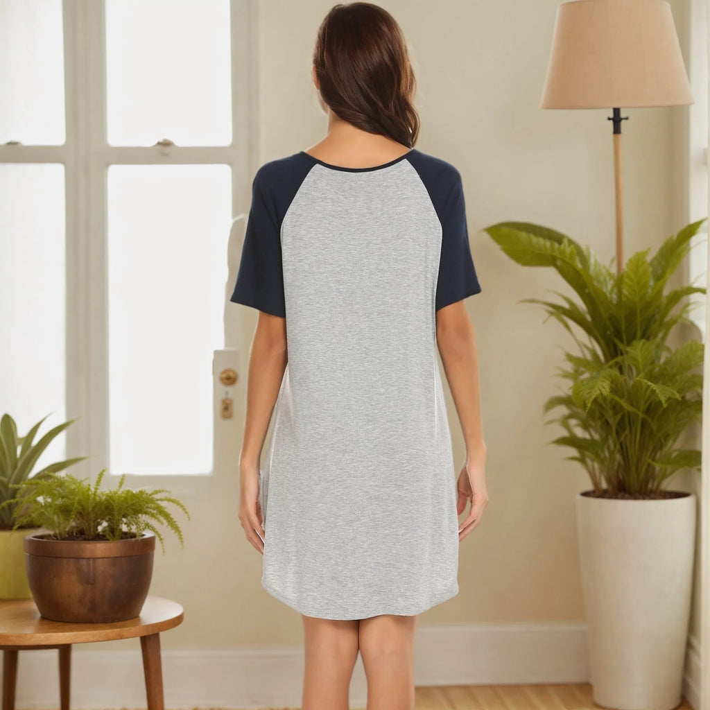 Women's double brushed milk silk nightdress with patchwork colour contrast sleeves on a hanger.