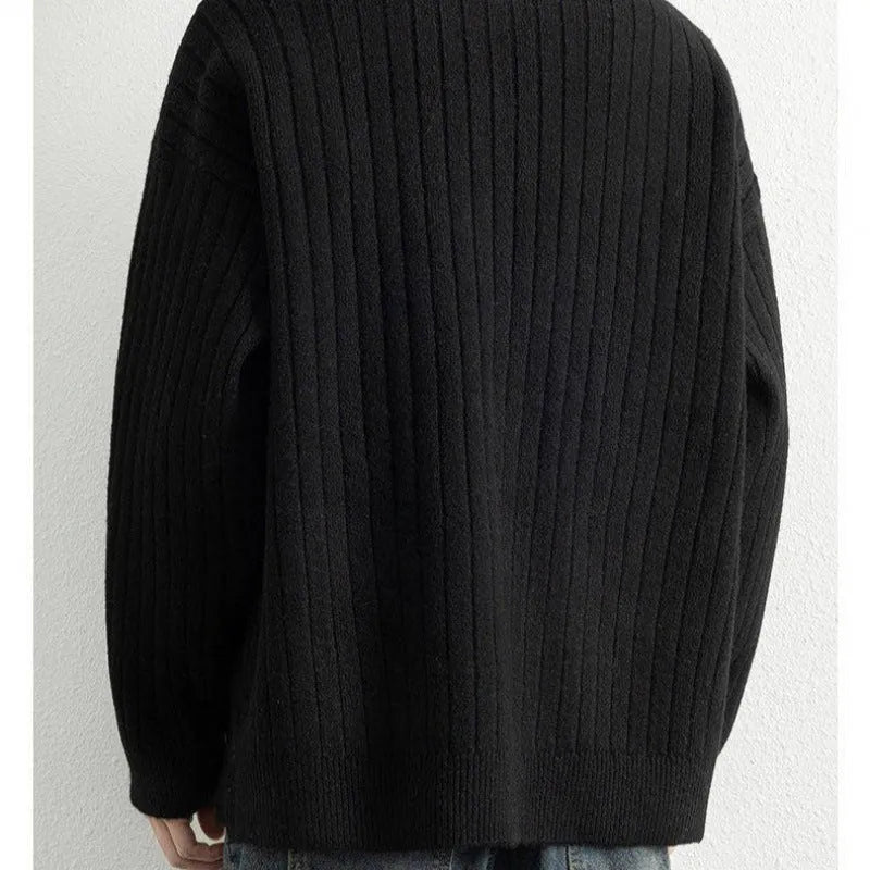 Men's grey half zip textured knit sweater showing loose fit design and adjustable zip closure