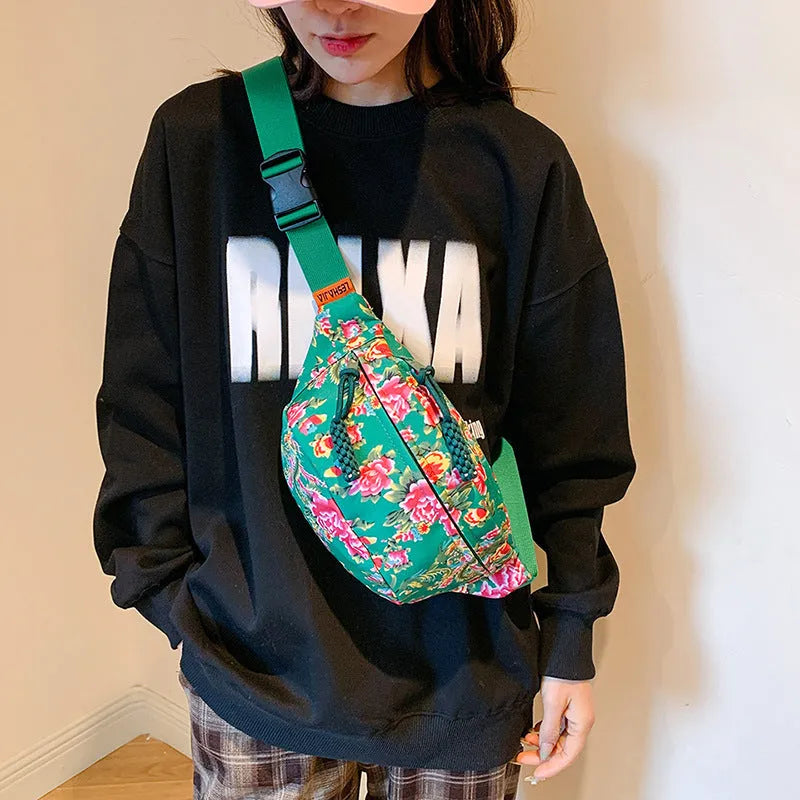 Western style women's waist bag with floral design in black, measuring 32cm wide with 3D pockets