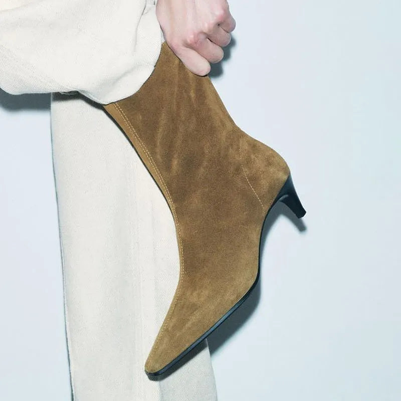 Brown square toe ankle boots with a side zip and a low kitten heel on a waterproof platform.