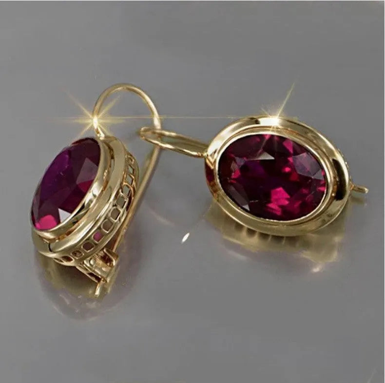 Red oval gemstone hollow earrings in electroplated alloy, geometric women's design, silver gold or rose gold finish